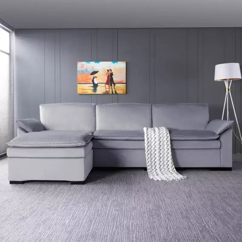 117.7 Divano componibile con pouf grigio scuro, in velluto.